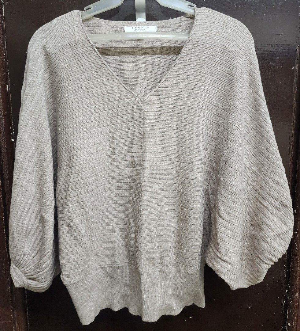 Liquid by Sioni V-neck Top (Category: Shirts) located in Las Pinas. Submitted by yramerim (Listing ID 1399678893, Image 1). Description: Size: small to semi large Mode of payment: Gcash,maya or rcbc Courier: LBC PLEASE MANAGE YOUR EXPECTATIONS. PRELOVED ITEMS NO CANCELLATION NO COD NO RETURN/NO EXCHANGE - V-neck design - Batwing sleeves - Ribbed texture - Fitted hem - Size: S - Color: Beige/Light Brown - Made in China.