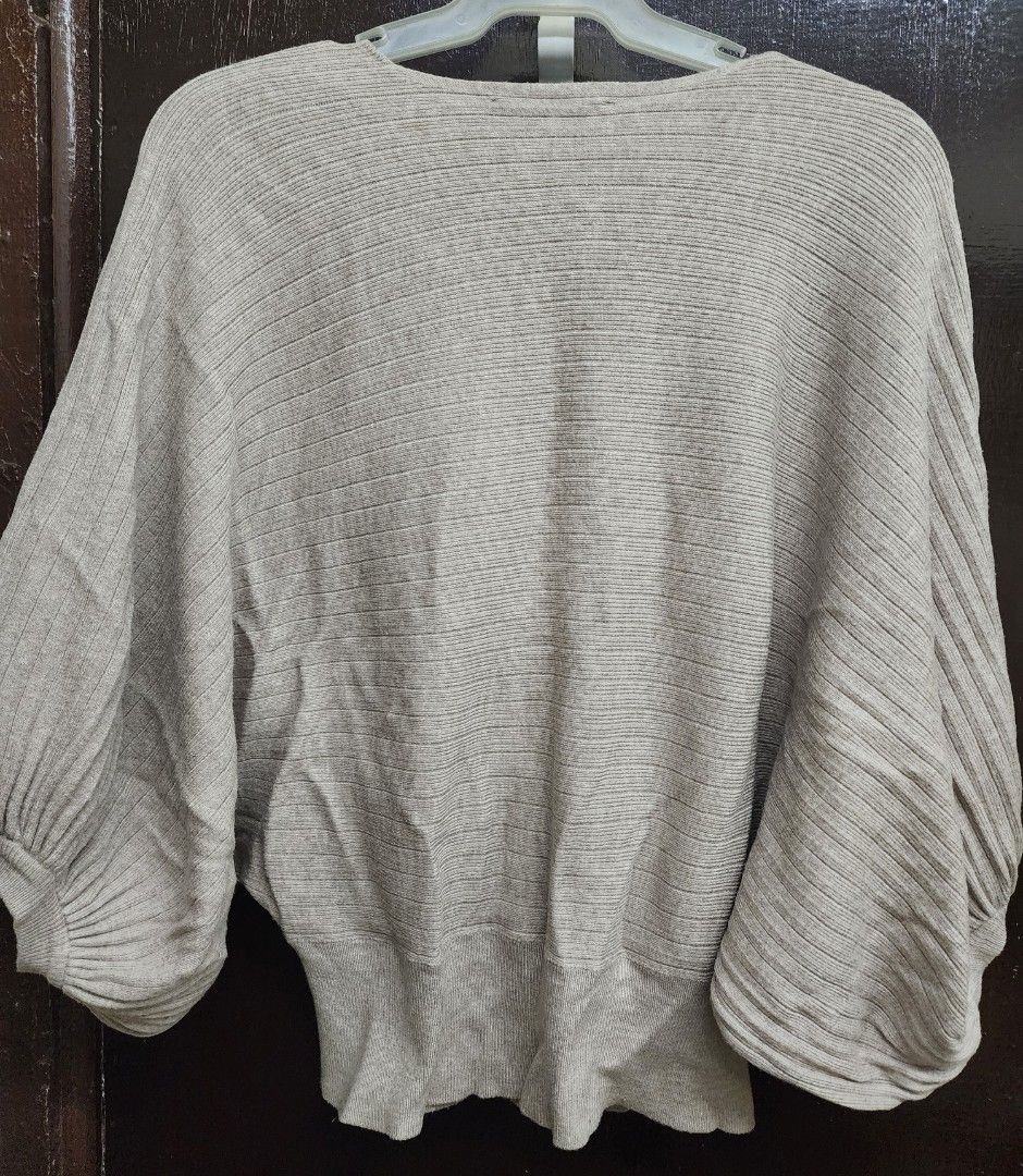 Liquid by Sioni V-neck Top (Category: Shirts) located in Las Pinas. Submitted by yramerim (Listing ID 1399678893, Image 2). Description: Size: small to semi large Mode of payment: Gcash,maya or rcbc Courier: LBC PLEASE MANAGE YOUR EXPECTATIONS. PRELOVED ITEMS NO CANCELLATION NO COD NO RETURN/NO EXCHANGE - V-neck design - Batwing sleeves - Ribbed texture - Fitted hem - Size: S - Color: Beige/Light Brown - Made in China.
