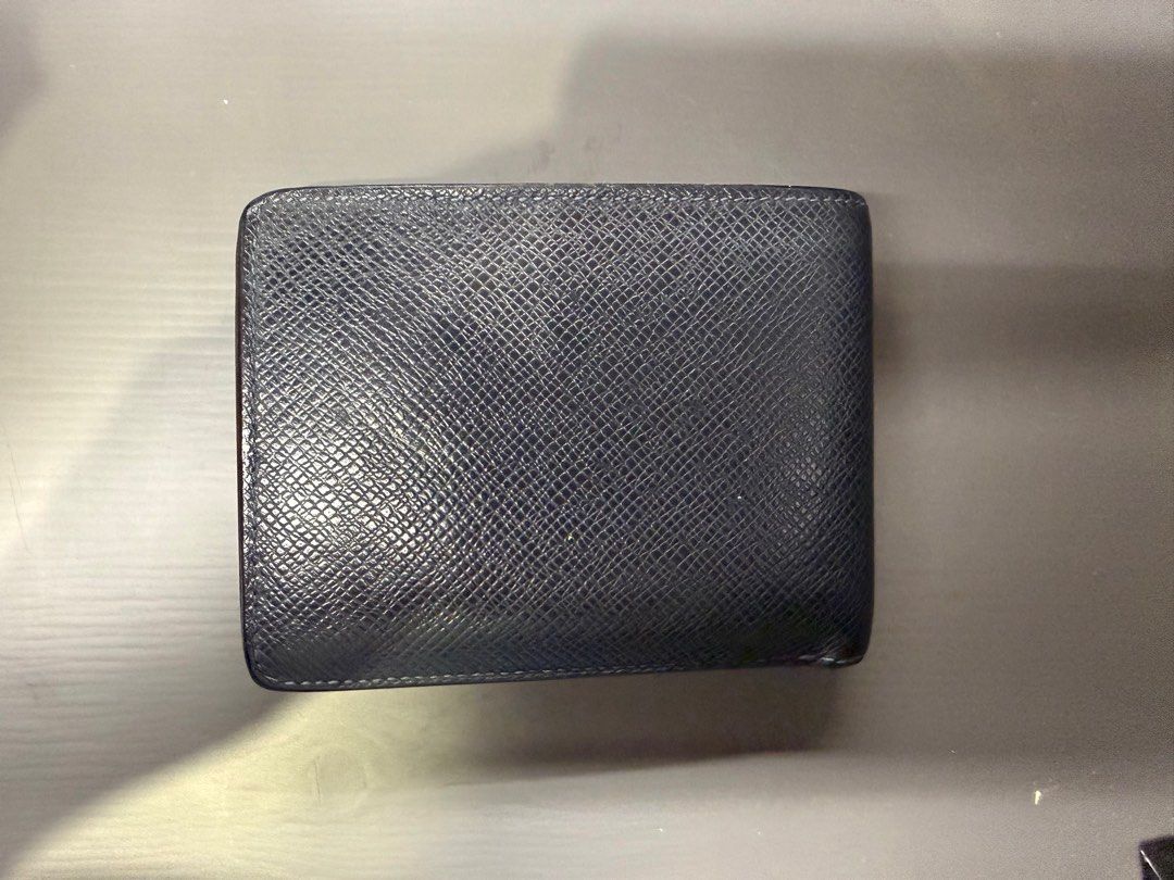 Louis Vuitton Multiple Wallet - Men (Category: Luxury Bags & Wallets) located in Caloocan City. Submitted by tidyhome.ph (Listing ID 1399804111, Image 2). Description: well-used condition.