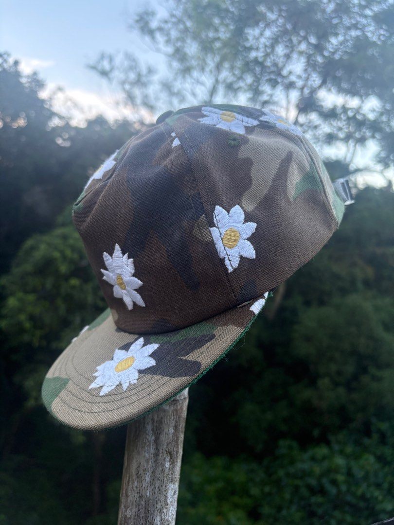 Mark McNairy New Amsterdam Camo Daisy Cap (Category: Caps & Hats) located in Quezon City. Submitted by sssourceee (Listing ID 1399734589, Image 3). Description: ORIGINAL MARK MCNAIRY VINTAGE DAISY CAMO HAT - Camouflage pattern cap - Features embroidered white daisy flowers - Made in the USA - Adjustable fit - One size fits most - Brand: "Mark McNairy" - Like new with tags.