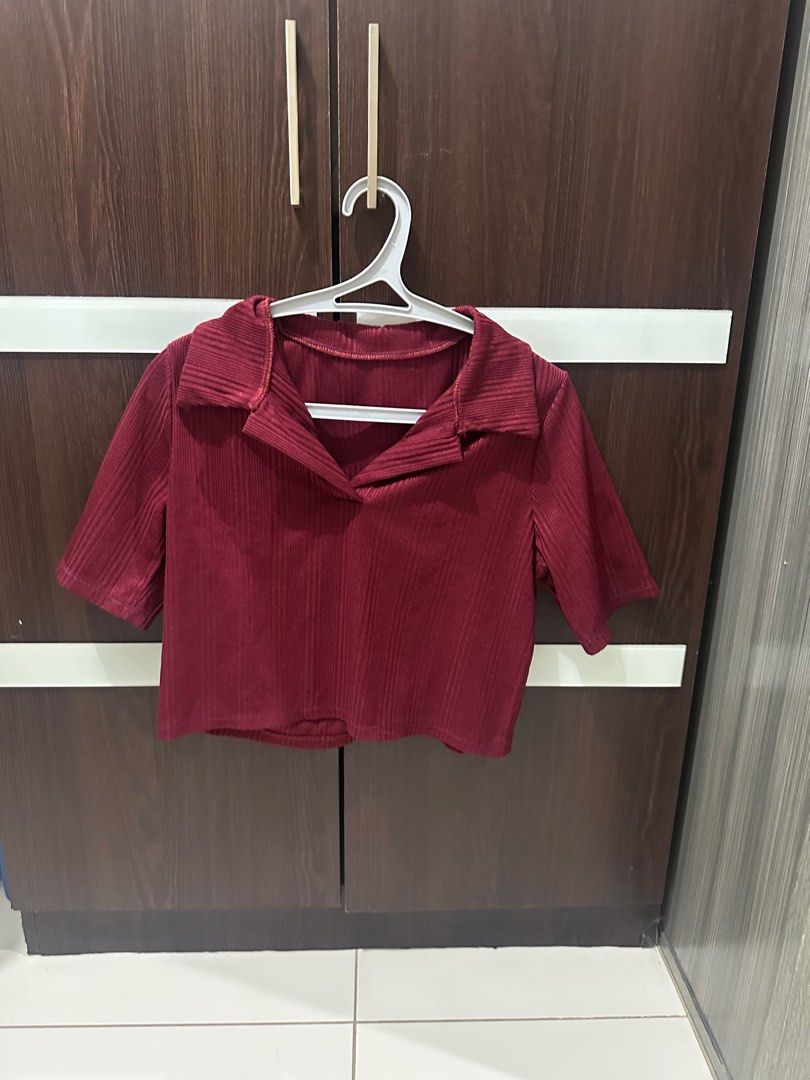 Maroon Collared Crop Top (Category: Blouses) located in Manila. Submitted by abcdeclutter__ (Listing ID 1399727603, Image 1). Description: - Maroon crop top - Collared neckline - Short sleeves - Ribbed texture - Casual wear.