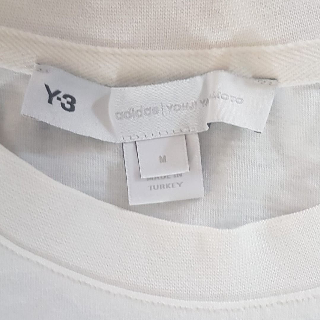 Original Y-3 Yohji Yamamoto T-Shirt, Cool White Tee, JAPAN, MEDIUM Top, Sleek Design, Sophistication, Streetwise, Sportswear, Timeless Appeal, Gen Z, Geek, Pop Culture, Hip Hop, Rock Star, Active Lifestyle, Summer Holiday, Cult Street Fashion (Category: Tshirts & Polo Shirts) located in Singapore. Submitted by warehouseno5 (Listing ID 1399712601, Image 3). Description: Original Y-3 Yohji Yamamoto T-Shirt, Cool White Tee, JAPAN, Sleek Design, Soph
