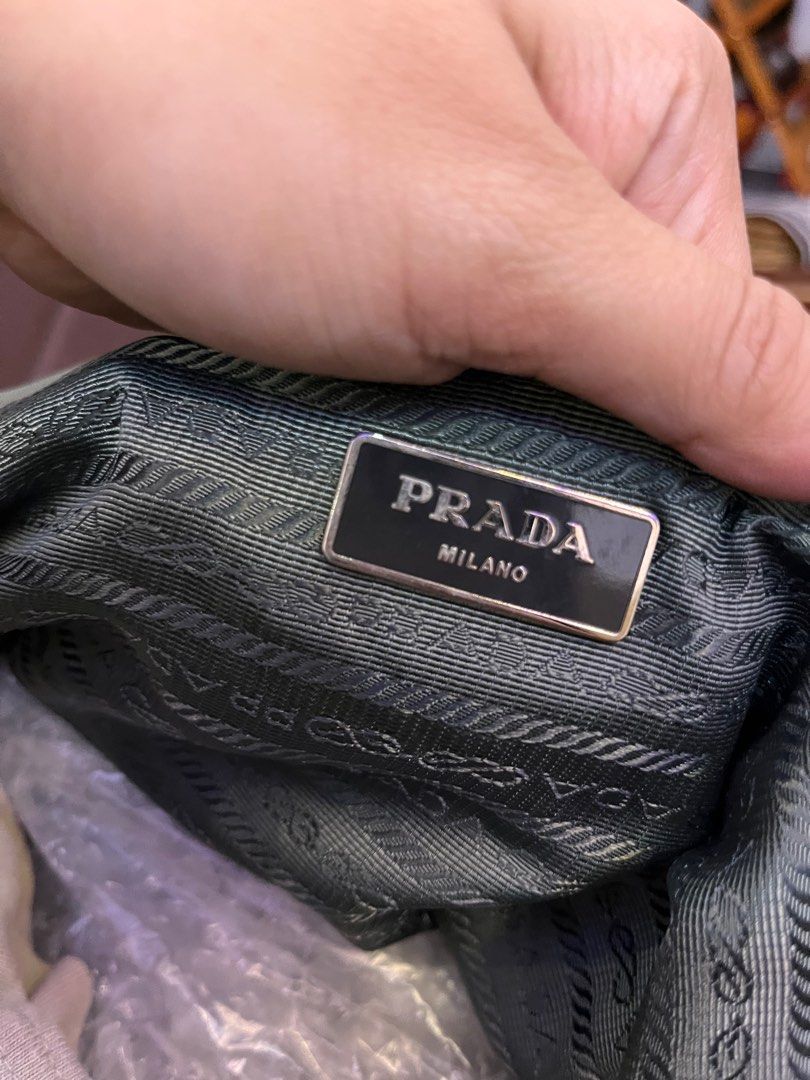 Prada Nylon Backpack (Category: Luxury Bags & Wallets) located in Manila. Submitted by japanluxpallete (Listing ID 1399822338, Image 3). Description: - Authentic Prada backpack - Green nylon material - Drawstring closure - Two side pockets - Adjustable straps - Interior zipper pocket - Prada Milano label inside - Flap closure with buckle - Prada logo on front - Prada logo pattern lining.