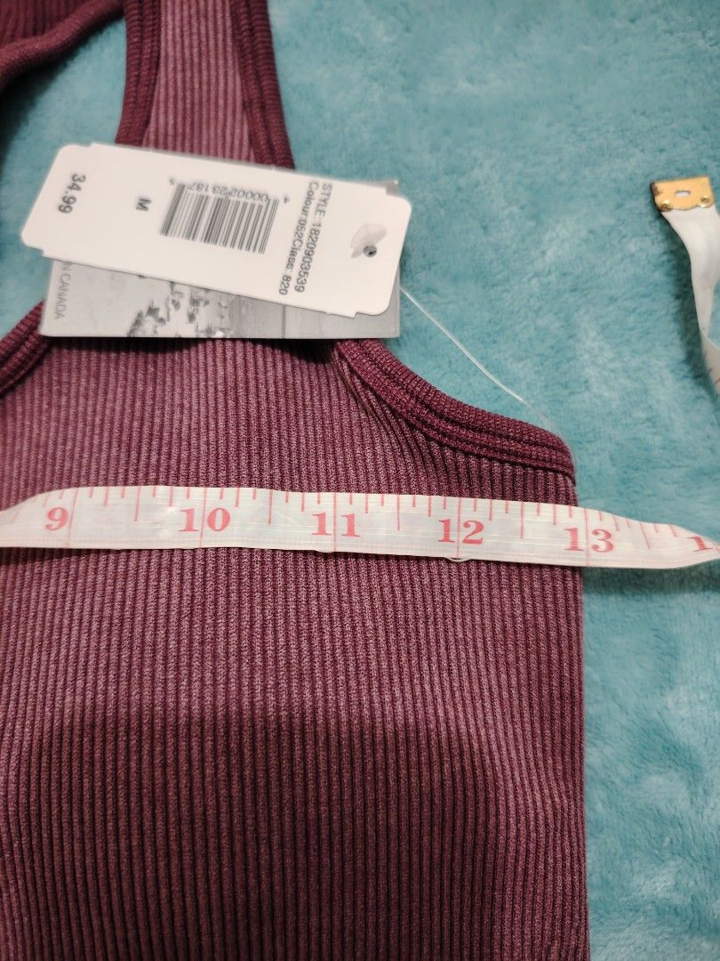 Ribbed Sports Bra - Size M (Category: Activewear) located in Manila. Submitted by shemstepszi (Listing ID 1399645669, Image 3). Description: - Maroon ribbed sports bra - Size: Medium - Racerback style - Seamless design for comfort - Soft and stretchy material - Perfect for workouts or everyday wear - Brand new with tags. Bust 13".