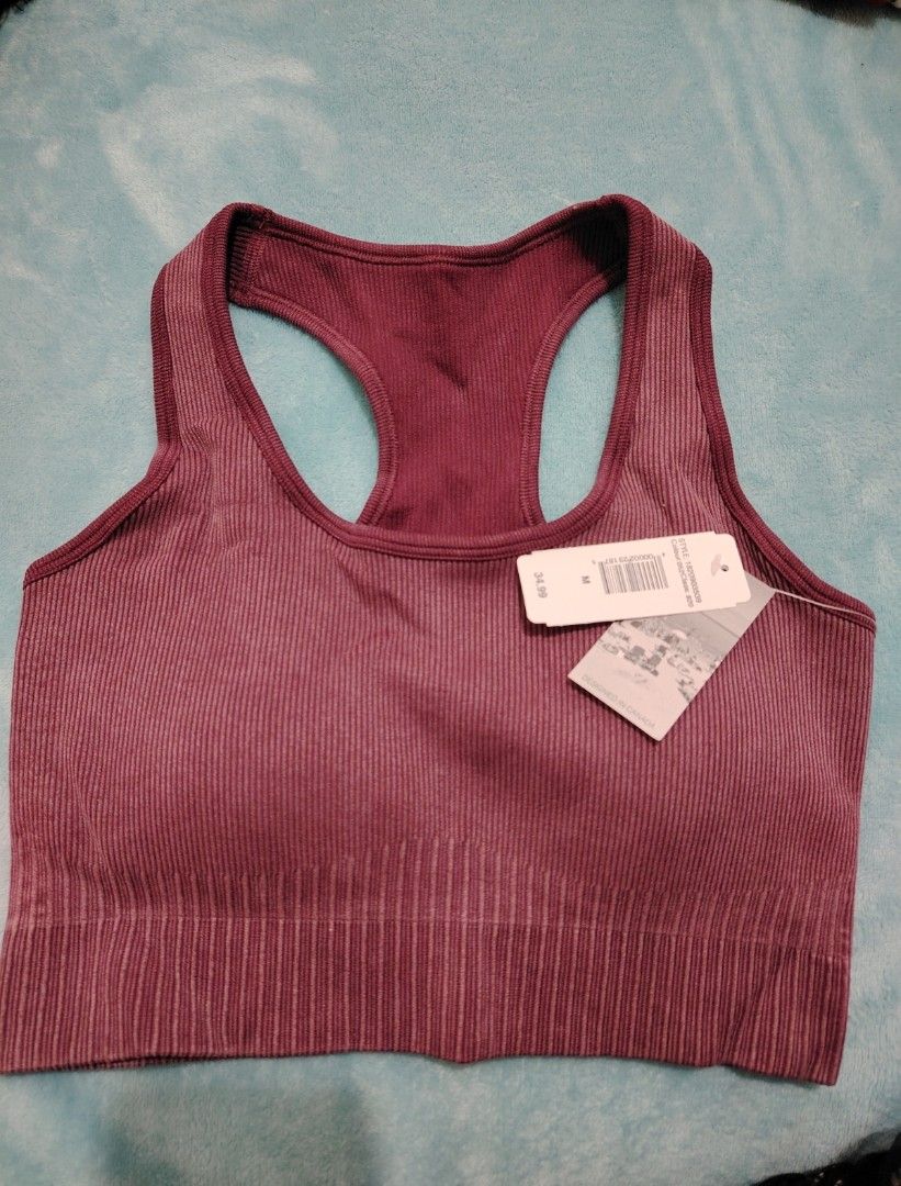 Ribbed Sports Bra - Size M (Category: Activewear) located in Manila. Submitted by shemstepszi (Listing ID 1399645669, Image 1). Description: - Maroon ribbed sports bra - Size: Medium - Racerback style - Seamless design for comfort - Soft and stretchy material - Perfect for workouts or everyday wear - Brand new with tags. Bust 13".