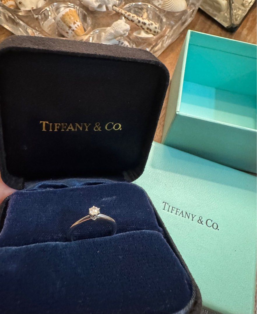 Tiffany & Co solitaire ring .18 ct, pt (Category: Rings) located in Las Pinas. Submitted by cath_mill (Listing ID 1399782133, Image 2). Description: Tiffany & Co solitaire diamond ring .18 ct, platinum band Size 5 With original teal & velvet box With markings Tiffany & Co Pt950 .18 ct & serial number So pretty & dainty for yourself or your girl Sparkles with blue & pink colors under the light (can provide video) RFS: has similar rings Gcash, bank