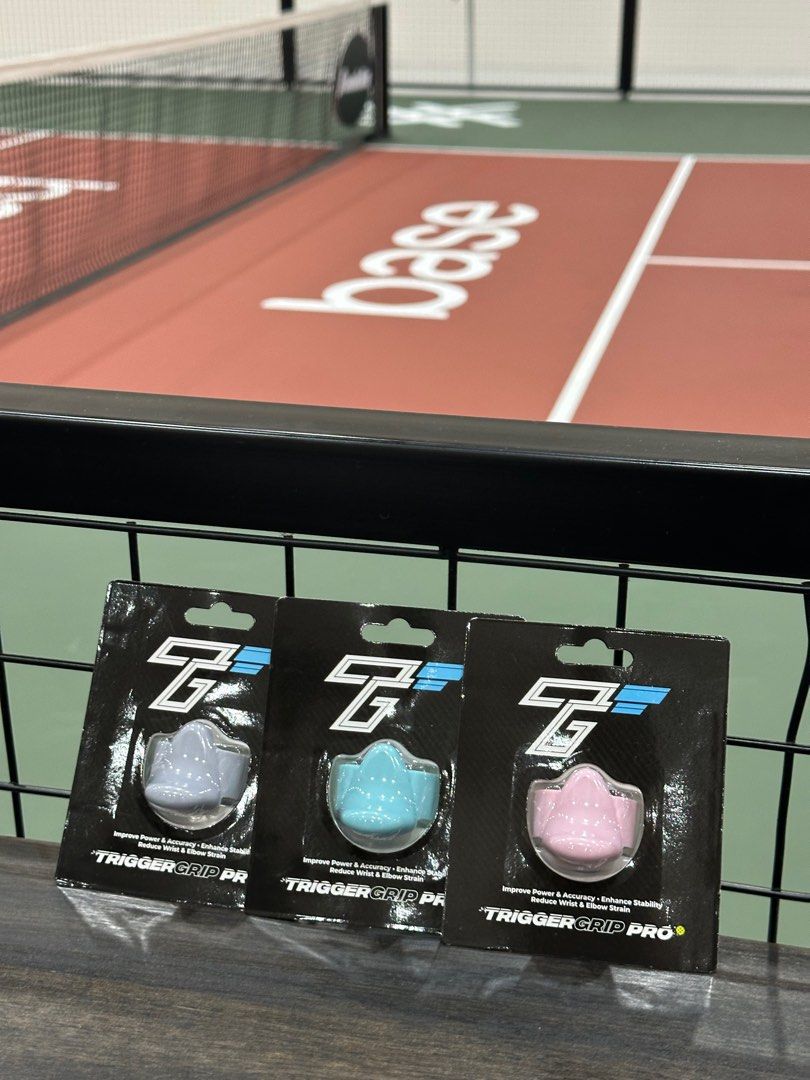 TriggerGrip Pro (Category: Racket & Ball Sports) located in Kuala Lumpur. Submitted by xalphius26 (Listing ID 1399812023, Image 2). Description: Enhance your game with the Trigger Grip Pro. These grips are designed to improve power and accuracy while reducing wrist and elbow strain. Available in three colours: grey, blue, and pink. Each grip is new and ready to be installed..