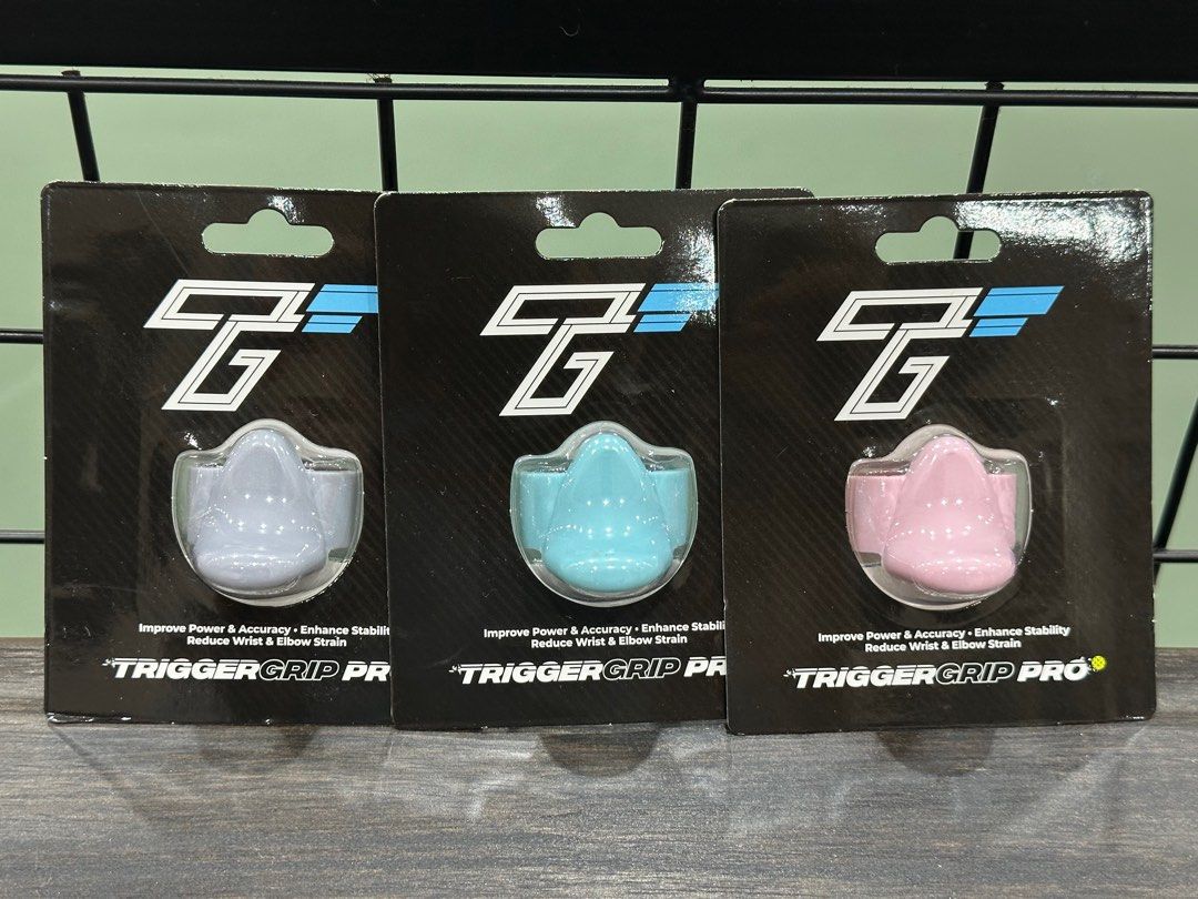 TriggerGrip Pro (Category: Racket & Ball Sports) located in Kuala Lumpur. Submitted by xalphius26 (Listing ID 1399812023, Image 1). Description: Enhance your game with the Trigger Grip Pro. These grips are designed to improve power and accuracy while reducing wrist and elbow strain. Available in three colours: grey, blue, and pink. Each grip is new and ready to be installed..