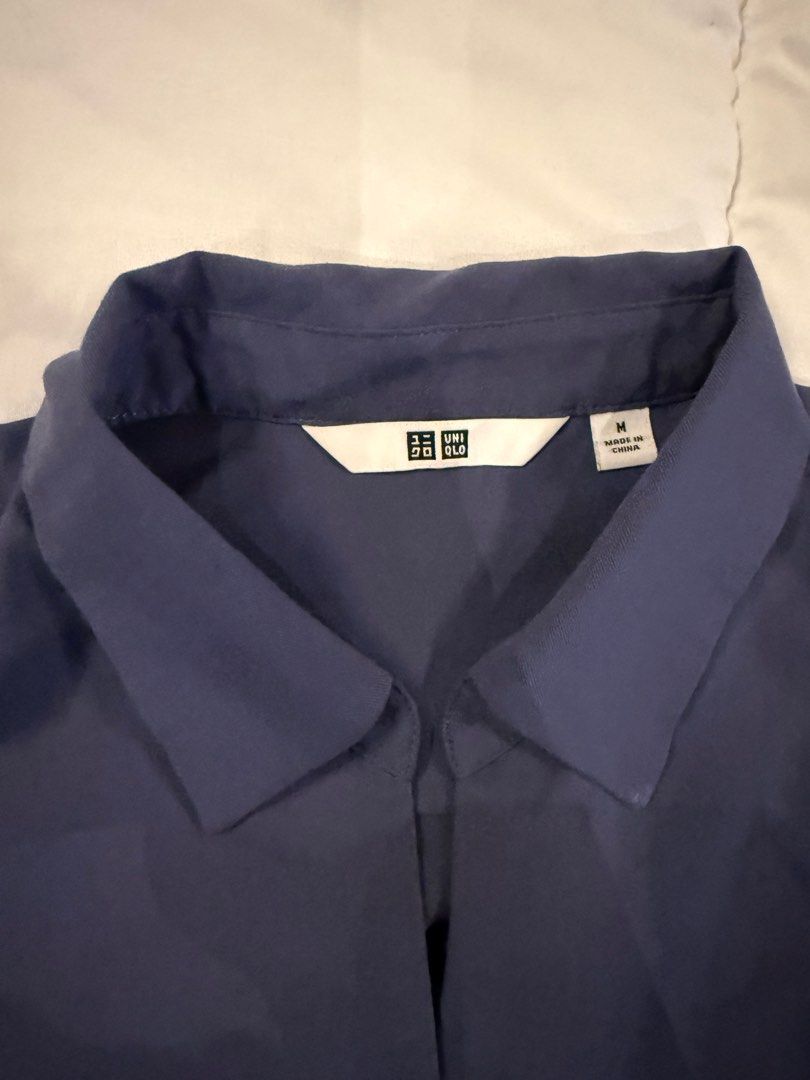 Uniqlo Navy Blue Shirt (Category: Shirts) located in Quezon City. Submitted by kc9876 (Listing ID 1399733683, Image 2). Description: - Uniqlo navy blue shirt - Color: Navy - Size: M - Features: Collared neckline, long sleeves, relaxed fit - Made in China.