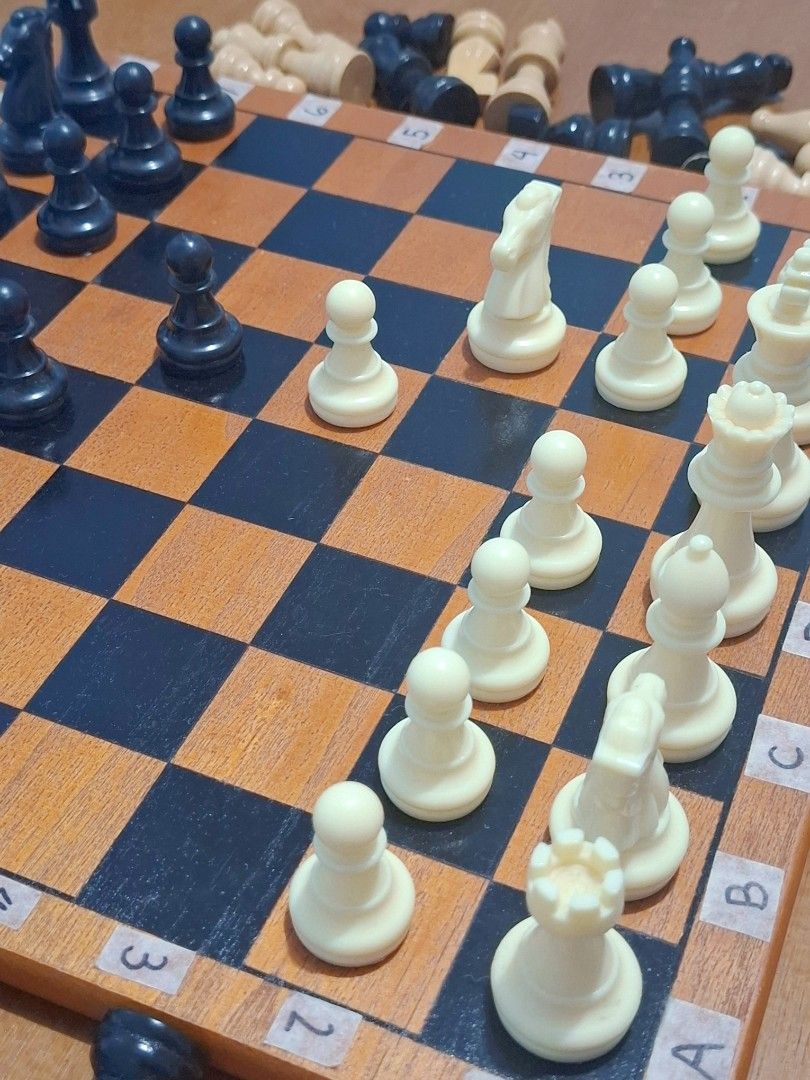 Wooden Chess Set (Category: Board Games & Puzzles) located in Antipolo. Submitted by desireekay70914 (Listing ID 1399721985, Image 2). Description: - Complete chess set - Wooden chessboard with removable labeled squares - Includes black and white chess pieces - Set includes both wooden and plastic pieces - Standard size board - Ready for play! no issue..