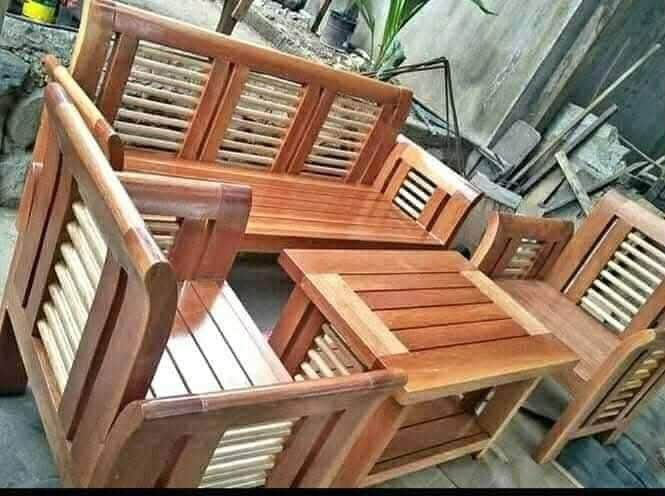 Wooden Living Room Set (Category: Sofas) located in Manila. Submitted by rhoda_81 (Listing ID 1399653208, Image 2). Description: pure mahogany wood ready to deliver fully furnish varnish Elegant wooden living room set. Includes a five-seater sofa, with armchairs, and a coffee table. The set features a rich, dark wood finish. The design incorporates slatted backrests and armrests. The coffee table . Perfect for adding a touch of classic style to y