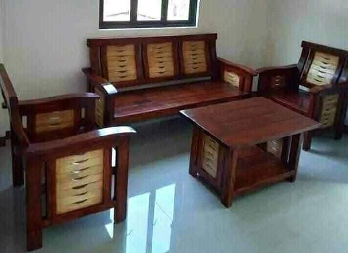 Wooden Living Room Set (Category: Sofas) located in Manila. Submitted by rhoda_81 (Listing ID 1399653208, Image 3). Description: pure mahogany wood ready to deliver fully furnish varnish Elegant wooden living room set. Includes a five-seater sofa, with armchairs, and a coffee table. The set features a rich, dark wood finish. The design incorporates slatted backrests and armrests. The coffee table . Perfect for adding a touch of classic style to y