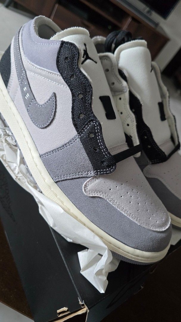 Air Jordan 1 Low SE Craft (Category: Sneakers) located in San Juan City. Submitted by aivveee (Listing ID 1399941282, Image 1). Description: Air Jordan 1 Low SE Craft in grey and black. Features a canvas and suede upper with a stitched Swoosh. Includes the original box. Size 11 US. The box indicates the colorway is "Grey/Black-Phantom-Sail"..