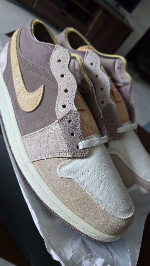 Air Jordan 1 Low SE Craft (Category: Sneakers) located in San Juan City. Submitted by aivveee (Listing ID 1399941709, Image 3). Description: Air Jordan 1 Low SE Craft in a unique colorway. Features a mix of brown, beige, and cream tones. The shoes have a textured design with the iconic Nike swoosh. Includes the original box. Size 11..