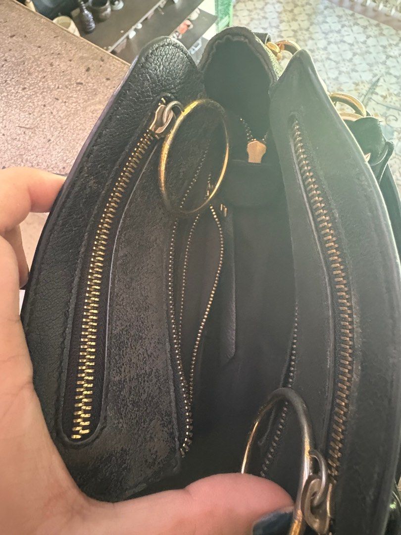 Authentic See by Chloe Black Top Handle Mini Bag (Category: Luxury Bags & Wallets) located in Quezon City. Submitted by gringottsss (Listing ID 1399831153, Image 2). Description: PLEASE READ Issue: Signs of use, please refer to photos This bag has that rugged vibe similar to Balenciaga’s city bag Dimensions: Width - 23.5; Height - 15.5; Depth - 12.5 cm Handle Drop: 7 cm (approx.) Long Strap Drop: 50/55 cm (approx.).