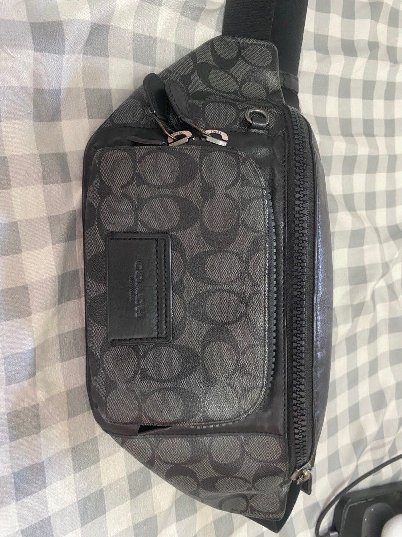 Coach track belt bag (Category: Luxury Bags & Wallets) located in Manila. Submitted by jtg199x (Listing ID 1399907024, Image 1). Description: - Authentic Coach sling bag - Signature pattern - Main compartment with zipper - Front pocket with zipper - Adjustable strap with buckle - Silver-toned hardware - Black color.