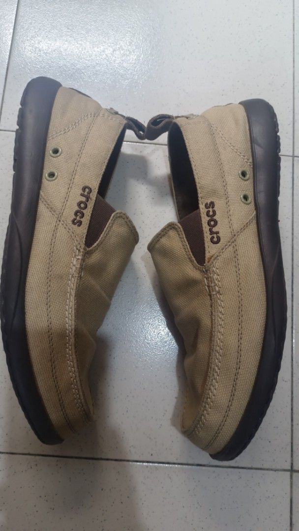 Crocs Men's Slip-on Shoes (Category: Casual Shoes) located in Muntinlupa City. Submitted by amara211629 (Listing ID 1399866318, Image 3). Description: - Tan Crocs slip-on shoes - Size: M11 - Canvas upper - Brown sole - Crocs logo visible - Ventilation holes on insole - Pull tab at the back.