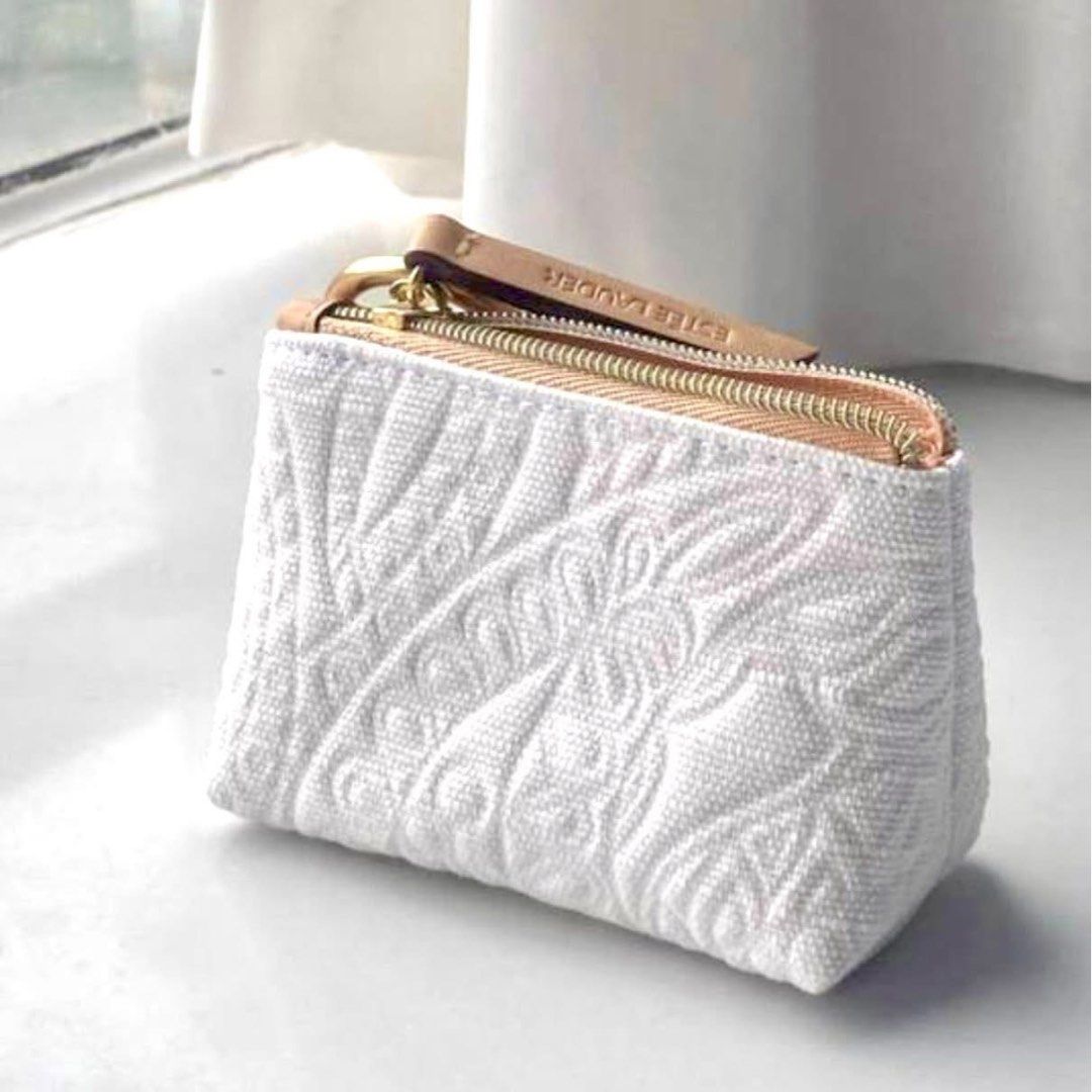Estee Lauder white floral small pouch (Category: Purses & Pouches) located in Paranaque City. Submitted by mrdy_. (Listing ID 1399955269, Image 1). Description: Pre order. ETA NOV Perfect lang gift / give away limited slots only. Pareserve na po. .