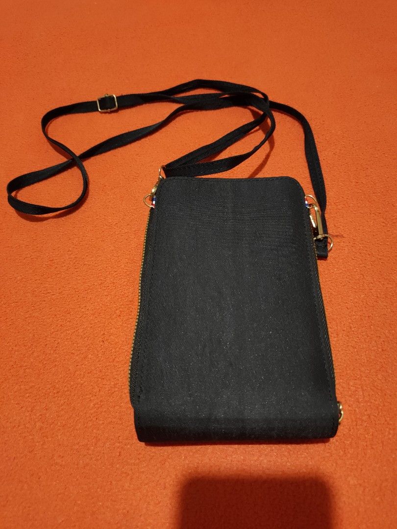 Kipling Mini Organizer Phone Bag (Category: Cross-body Bags) located in Quezon City. Submitted by jhaneth21 (Listing ID 1399985957, Image 3). Description: Jet Black 2 Zip Compartments Main Compartment with 2 Phone Slots Front Zip Compartment for Essentials Gold Hardware No Issue Color Rate 10/10 .