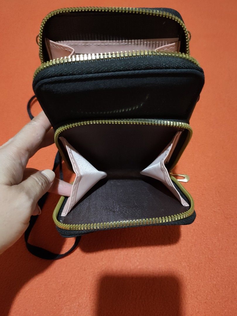 Kipling Mini Organizer Phone Bag (Category: Cross-body Bags) located in Quezon City. Submitted by jhaneth21 (Listing ID 1399985957, Image 2). Description: Jet Black 2 Zip Compartments Main Compartment with 2 Phone Slots Front Zip Compartment for Essentials Gold Hardware No Issue Color Rate 10/10 .