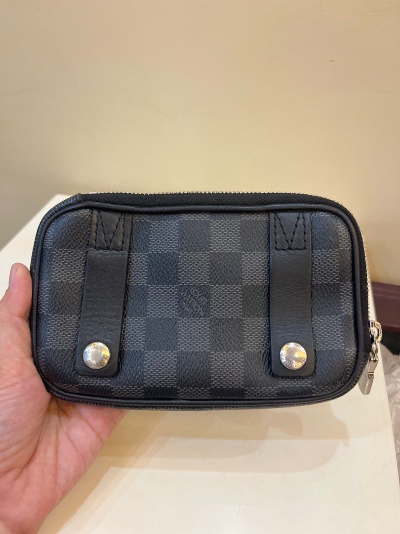 Louis Vuitton Damier Graphite Key Pouch (Category: Luxury Bags & Wallets) located in Tagum. Submitted by mats0830 (Listing ID 1399939500, Image 2). Description: - Authentic Louis Vuitton key pouch - Damier Graphite canvas - Secure zip closure - Iconic Louis Vuitton logo patch - Stylish checkered pattern - Includes two straps - Silver-tone hardware.