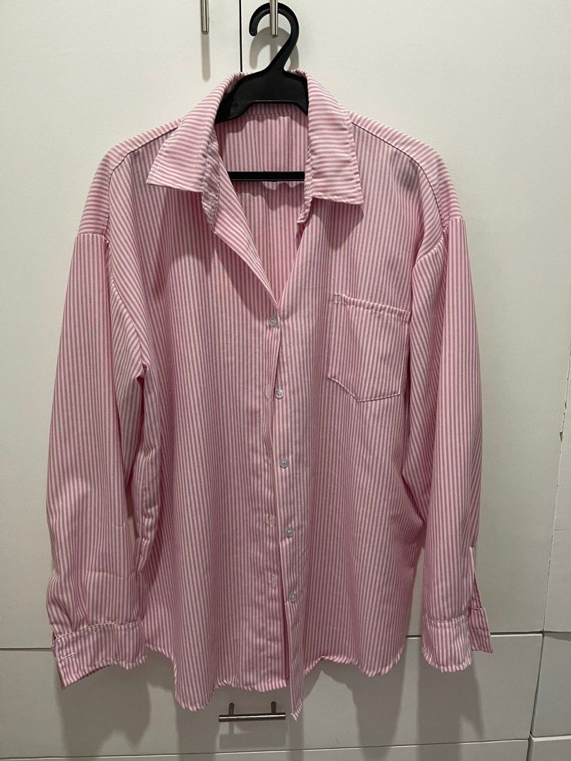 Pink Striped Oversized Long sleeve Shirt (Category: Shirts) located in Bulacan. Submitted by missjs19 (Listing ID 1400012828, Image 1). Description: Oversized polo. Height is 5’7 and this is the length on her. I’m L but this is still big on me. Only used once. NO FLAW No brand, from Greenhills. SF will be shouldered by the buyer.