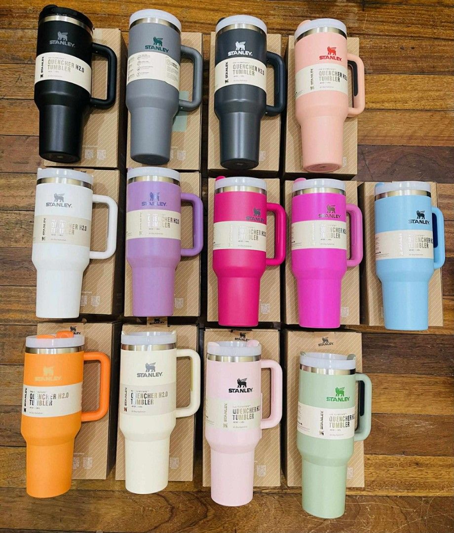 Stanley Quencher H2.0 Tumbler (Category: Water Bottles & Tumblers) located in Batangas. Submitted by YSABELLE_MARGARETTE (Listing ID 1399987251, Image 1). Description: Stanley Quencher H2.0 Tumblers available in various colors. Features a handle for easy carrying and a durable design. The tumblers come with their original boxes. Available colors include black, gray, dark gray, pink, white, purple, orange, light pink, green, and blue. Perfect for 