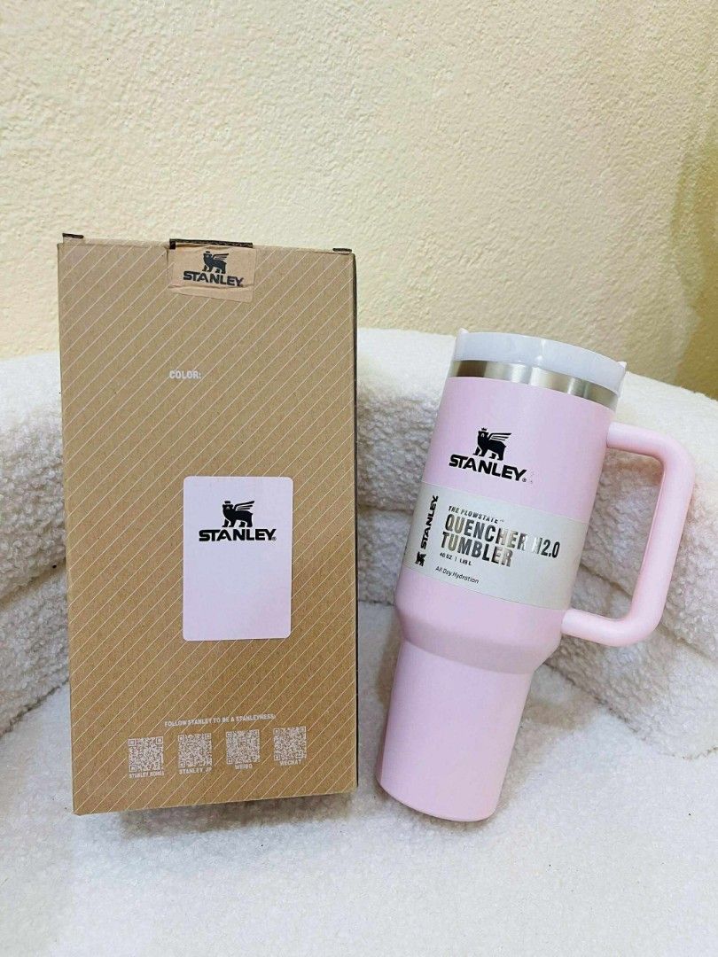 Stanley Quencher H2.0 Tumbler (Category: Water Bottles & Tumblers) located in Batangas. Submitted by YSABELLE_MARGARETTE (Listing ID 1399987251, Image 3). Description: Stanley Quencher H2.0 Tumblers available in various colors. Features a handle for easy carrying and a durable design. The tumblers come with their original boxes. Available colors include black, gray, dark gray, pink, white, purple, orange, light pink, green, and blue. Perfect for 
