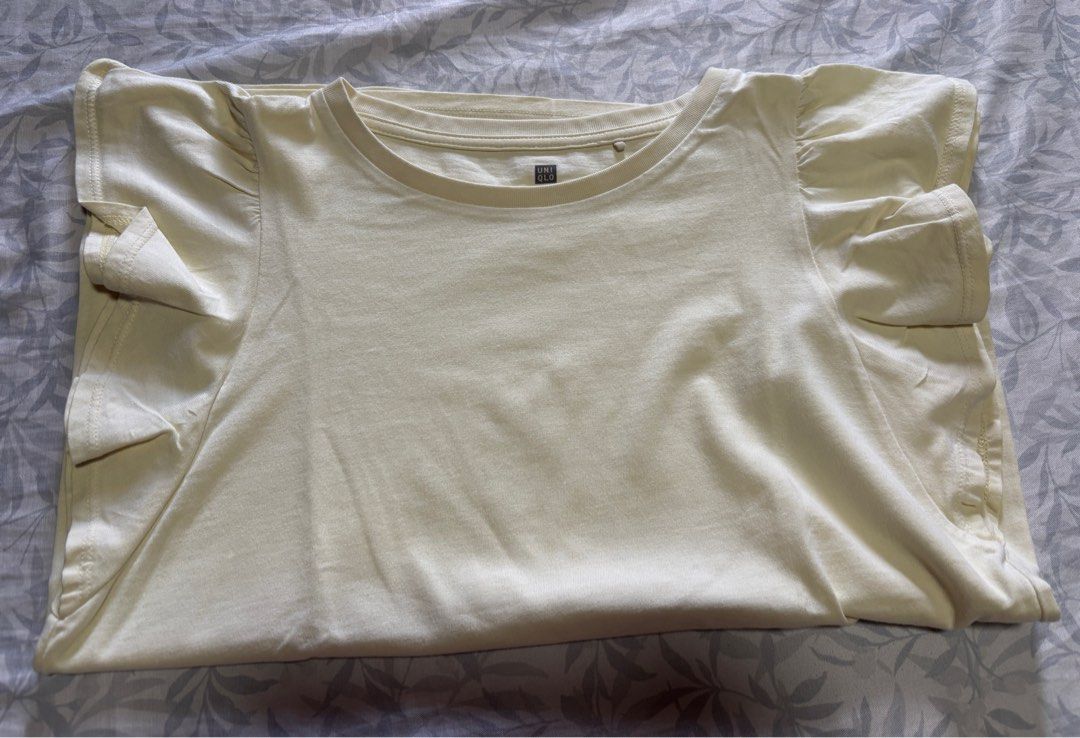 Yellow Ruffle Sleeve T-shirt (Category: Shirts) located in Quezon City. Submitted by rosemelendres02 (Listing ID 1399854470, Image 2). Description: Tag Size - 130 - Yellow t-shirt - Round neckline - Short sleeves with ruffle details - Soft, lightweight fabric - Straight hemline - Versatile and easy to style.