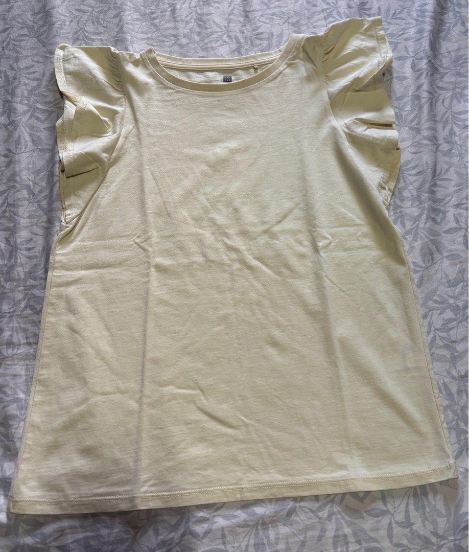 Yellow Ruffle Sleeve T-shirt (Category: Shirts) located in Quezon City. Submitted by rosemelendres02 (Listing ID 1399854470, Image 1). Description: Tag Size - 130 - Yellow t-shirt - Round neckline - Short sleeves with ruffle details - Soft, lightweight fabric - Straight hemline - Versatile and easy to style.