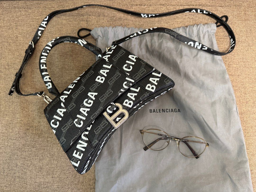Balenciaga Everyday XS Camera Bag (Category: Luxury Bags & Wallets) located in Taguig. Submitted by mommy_babymama (Listing ID 1400167247, Image 1). Description: Authentic Balenciaga Hourglass Small Top Handle Bag in BB Monogram Coated Canvas (excluding the glasses) Original price ₱142k You can check authenticity at Shangri-La mall.