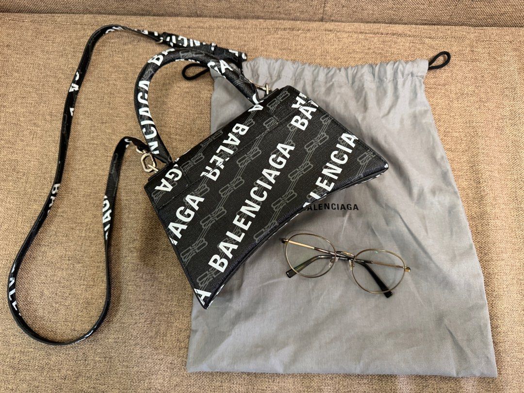 Balenciaga Everyday XS Camera Bag (Category: Luxury Bags & Wallets) located in Taguig. Submitted by mommy_babymama (Listing ID 1400167247, Image 2). Description: Authentic Balenciaga Hourglass Small Top Handle Bag in BB Monogram Coated Canvas (excluding the glasses) Original price ₱142k You can check authenticity at Shangri-La mall.