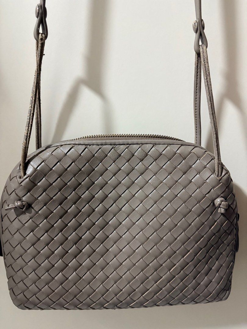 Bottega veneta nodini sling (Category: Luxury Bags & Wallets) located in Pasig City. Submitted by closetdiet (Listing ID 1400164940, Image 1). Description: BV Intrecciato woven napa leather nodini Parts of strap with peeling leather but can be repaired Otherwise in good condition.