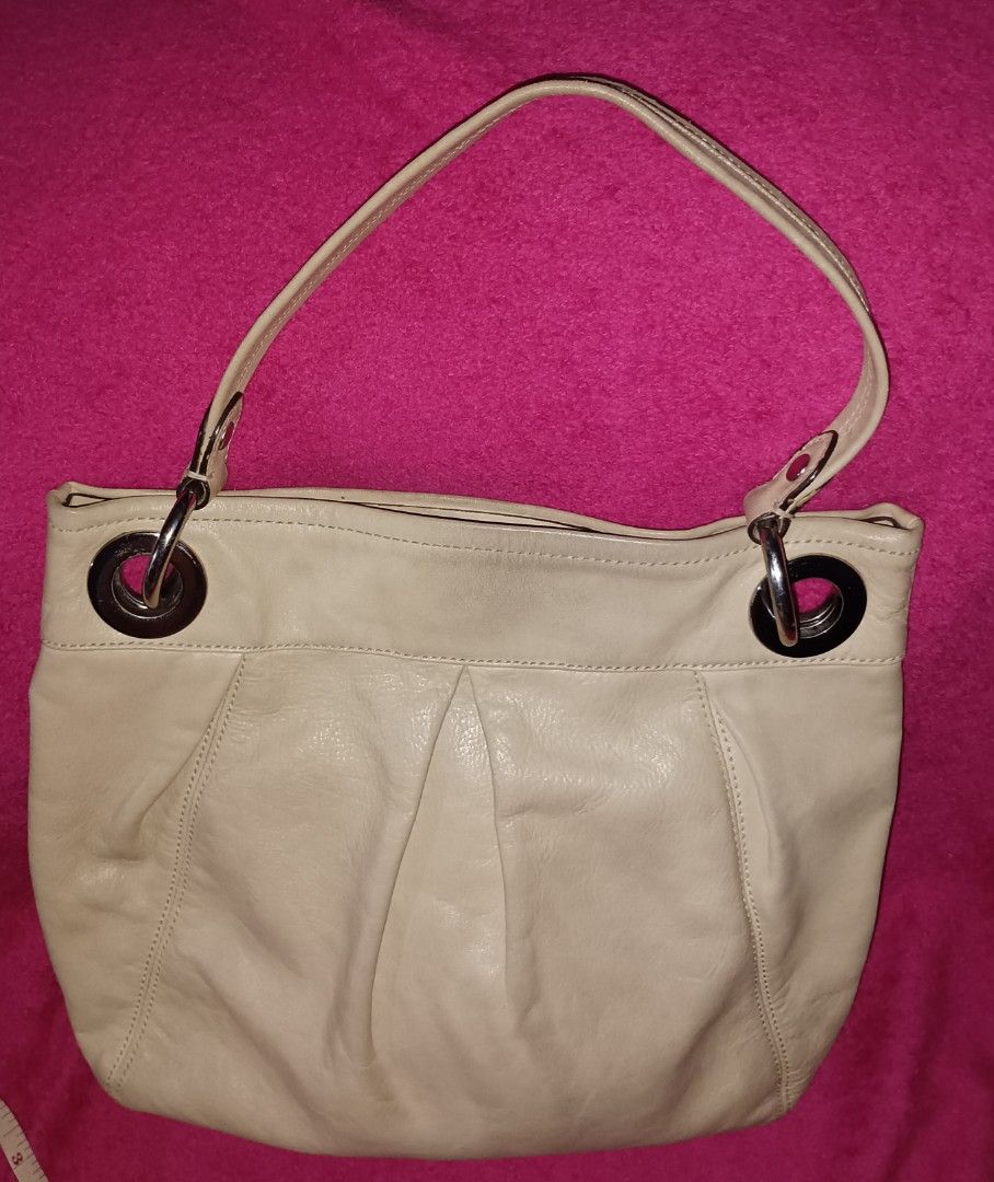 Vintage - Coach Madison Hobo (Category: Luxury Bags & Wallets) located in Pasig City. Submitted by prelovednimena (Listing ID 1400111016, Image 2). Description: Coach Madison Ivory Hobo material: leather with white buckle color: Ivory 11" x 13" with inside pockets for cellphone and another one with zipper. lining is in old rose color clean inside actual photo posted I personally own this bag. I have this in 1999. missing tag and strap RFS: too ma