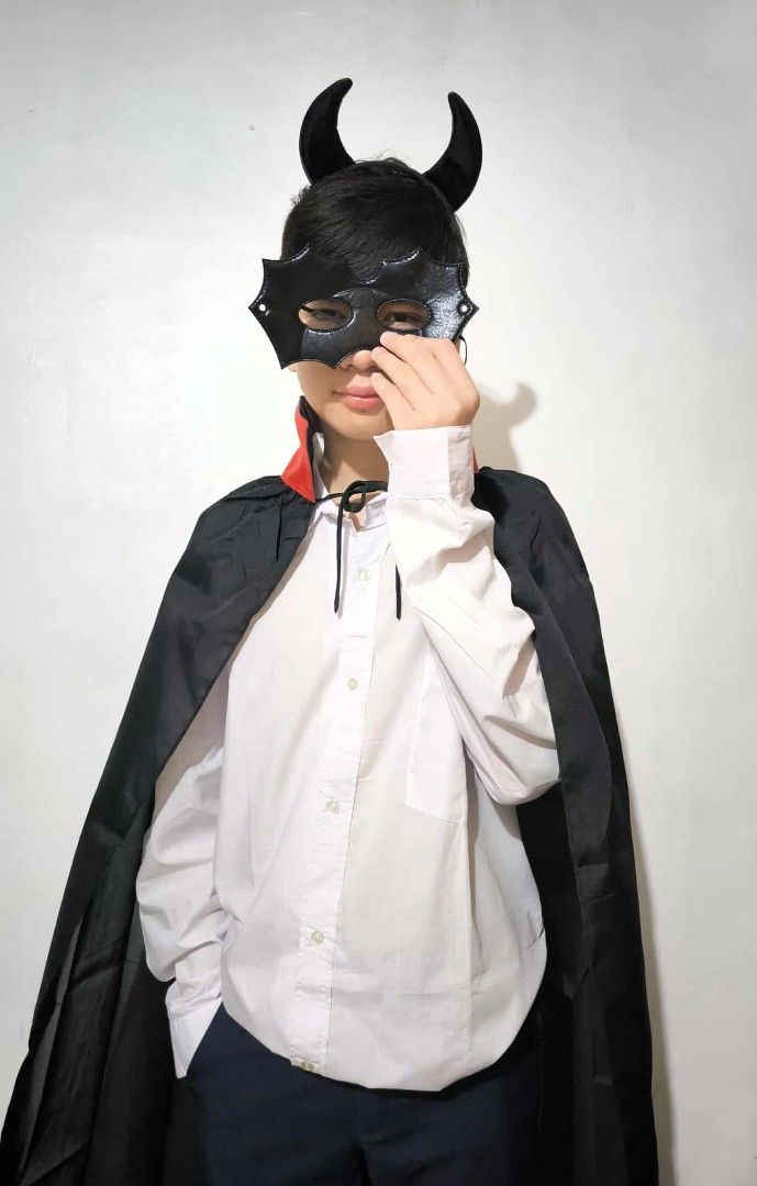 Devil Cape Costume (Category: Babies & Kids Fashion) located in Marikina City. Submitted by alecfordy (Listing ID 1400111381, Image 2). Description: - Devil costume perfect for Halloween or costume parties! - Includes a black cape with a red collar. -horn and mask 100 pesos - Features a unique black devil mask with horns. - Cape made of smooth, dark fabric. - Suitable for various events..