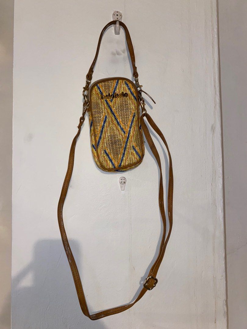 Halohalo Cellphone Bag (Category: Cross-body Bags) located in Pasig City. Submitted by raspberryfurs (Listing ID 1400161156, Image 2). Description: Beautifully handwoven cellphone bag from Halohalo, featuring vibrant yellow, blue, and orange patterns with genuine leather trim. Fits all phone sizes and small essentials perfectly — ideal for casual days or travel..