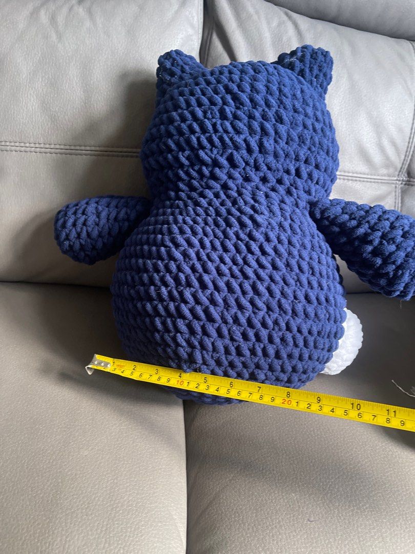 Handmade Crochet Snorlax Plushie (Category: Plushies & Soft Toys) located in San Juan City. Submitted by nhelsky_c (Listing ID 1400062485, Image 3). Description: - Handmade Snorlax plushie - Made with soft, chunky yarn - Color scheme: Navy blue, white, and pink - Dimensions: Approximately 16 inches tall, 12 inches wide - Great for Pokemon fans and collectors! - Perfect gift idea.