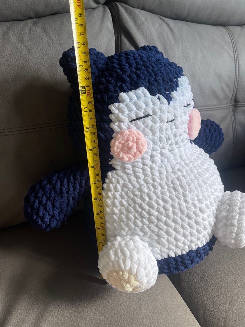 Handmade Crochet Snorlax Plushie (Category: Plushies & Soft Toys) located in San Juan City. Submitted by nhelsky_c (Listing ID 1400062485, Image 1). Description: - Handmade Snorlax plushie - Made with soft, chunky yarn - Color scheme: Navy blue, white, and pink - Dimensions: Approximately 16 inches tall, 12 inches wide - Great for Pokemon fans and collectors! - Perfect gift idea.
