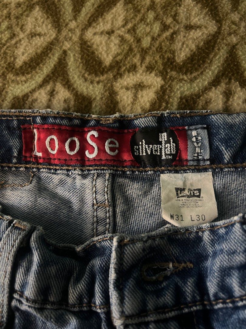 Levi's Silver Tab Loose Fit Jeans (Category: Jeans) located in Iligan City. Submitted by antonioibo024 (Listing ID 1400043083, Image 3). Description: - Levi's Silver Tab loose fit jeans - Size: W31 L30 - Medium wash - Classic five-pocket design - Button and zipper closure - Levi's logo on back pocket - Made of denim.