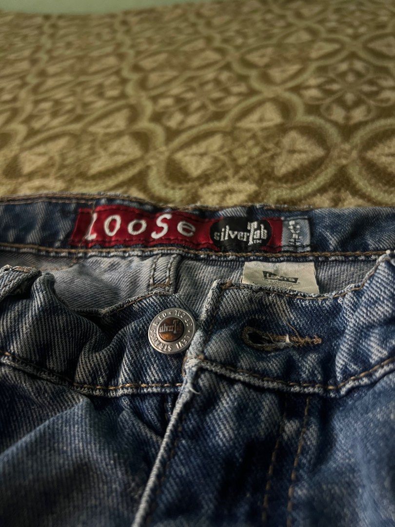 Levi's Silver Tab Loose Fit Jeans (Category: Jeans) located in Iligan City. Submitted by antonioibo024 (Listing ID 1400043083, Image 1). Description: - Levi's Silver Tab loose fit jeans - Size: W31 L30 - Medium wash - Classic five-pocket design - Button and zipper closure - Levi's logo on back pocket - Made of denim.