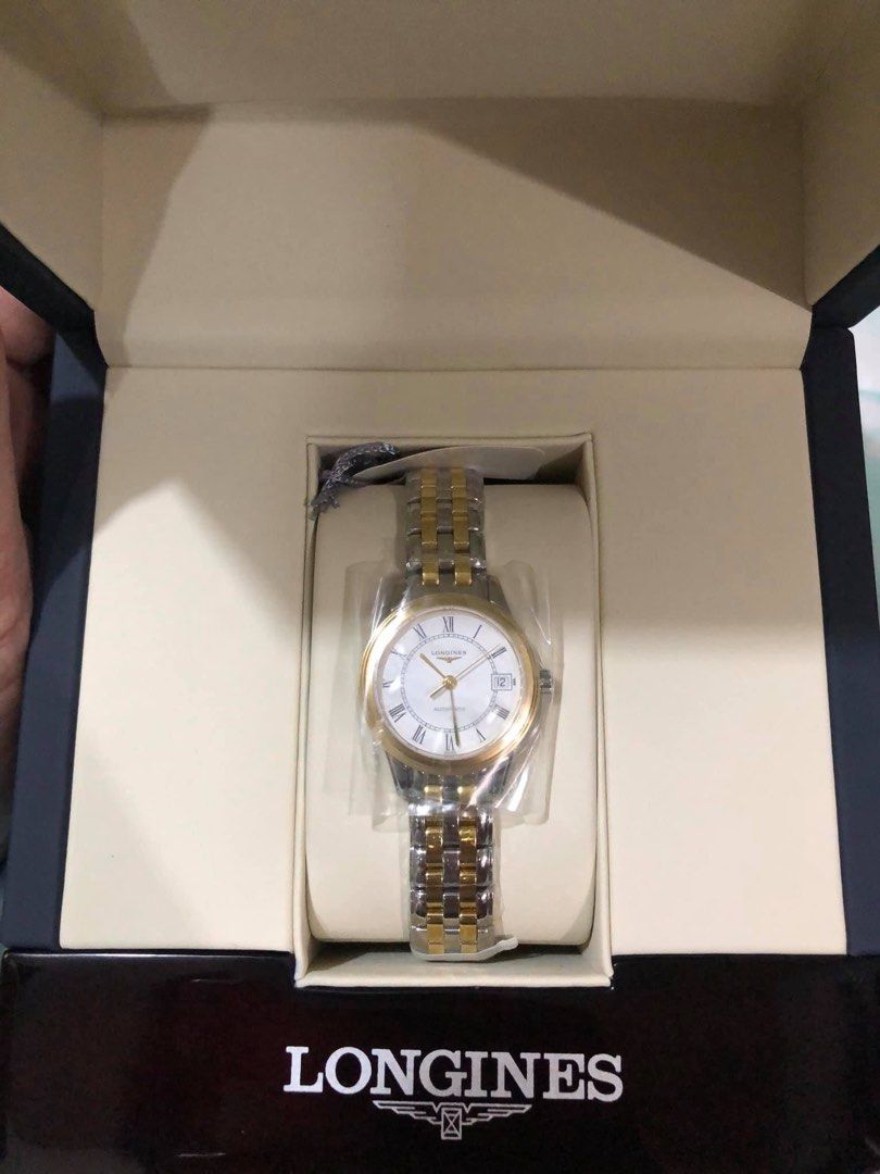 Longines Flagship 26mm Stainless Steel/PVD Automatic (Category: Luxury Watches) located in Malabon City. Submitted by immaneedspace (Listing ID 1400151372, Image 3). Description: FLAGSHIP 26MM STAINLESS STEEL/PVD AUTOMATIC (L42743217) Included * Longines Timepiece * User Manual * Watch Box * Warranty Card CASE Case Back: Transparent case back Dimension: 26.00 mm Lug Distance: 12 mm Glass: Sapphire with several layers of anti-reflective coating Ma