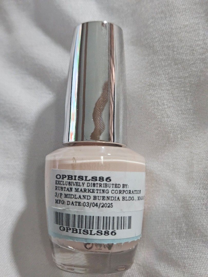 O.P.I Infinite Shine 2 Bubble Bath Nail Polish (Category: Hands & Nails) located in Cauayan City . Submitted by milibertad (Listing ID 1400022140, Image 2). Description: O.P.I Infinite Shine 2 nail polish in the shade Bubble Bath. The bottle contains 15ml/0.5 fl oz. The manufacturing date is 03/04/2025. The product code is OPBISL86. The nail polish is a light, neutral color. The bottle has a silver cap..