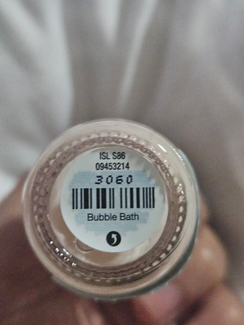 O.P.I Infinite Shine 2 Bubble Bath Nail Polish (Category: Hands & Nails) located in Cauayan City . Submitted by milibertad (Listing ID 1400022140, Image 3). Description: O.P.I Infinite Shine 2 nail polish in the shade Bubble Bath. The bottle contains 15ml/0.5 fl oz. The manufacturing date is 03/04/2025. The product code is OPBISL86. The nail polish is a light, neutral color. The bottle has a silver cap..