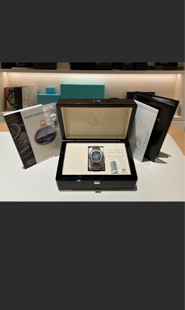 Patek Philippe 5990/1A-011 BRAND NEW (Category: Watches) located in Singapore. Submitted by user06701 (Listing ID 1400058589, Image 2). Description: Mar 2023 Patek Philippe Nautilus Bracelet 5990/1A-011 PP Sunburst Blue Dial PW25427 Brand: Patek Philippe Model: 5990/1A-011 Condition: New Dial: Sunburst Blue Case Diameter: 40.5mm Material: Stainless Steel Original Box: Yes Original Cert/Papers: Yes Dated: Mar 2023 Warranty: Manufacturer’s Warranty