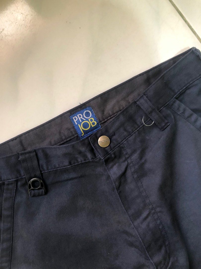 Pro Job Work Pants (Category: Joggers) located in Bien Unido. Submitted by thriftsnikulot (Listing ID 1400104653, Image 2). Description: - Pro Job work pants - Dark navy color - Multiple pockets for storage - Classic design - Belt loops and button closure - Pro Job logo visible - Made of sturdy material.