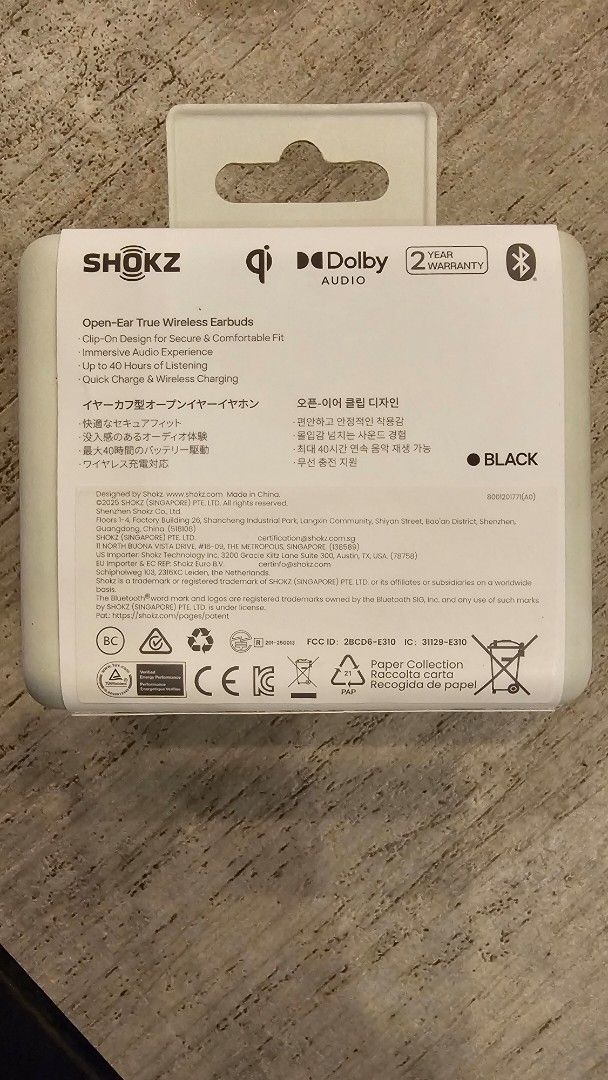 Shokz OpenDots One True Wireless Earbuds (Category: Earphones) located in Angeles City. Submitted by jumbo747 (Listing ID 1400141064, Image 2). Description: Shokz OpenDots One true wireless earbuds. Features Dolby Audio and Qi wireless charging. Comes in black. Includes a 2-year warranty. The box shows the earbuds and their charging case. The earbuds are designed for open-ear listening..