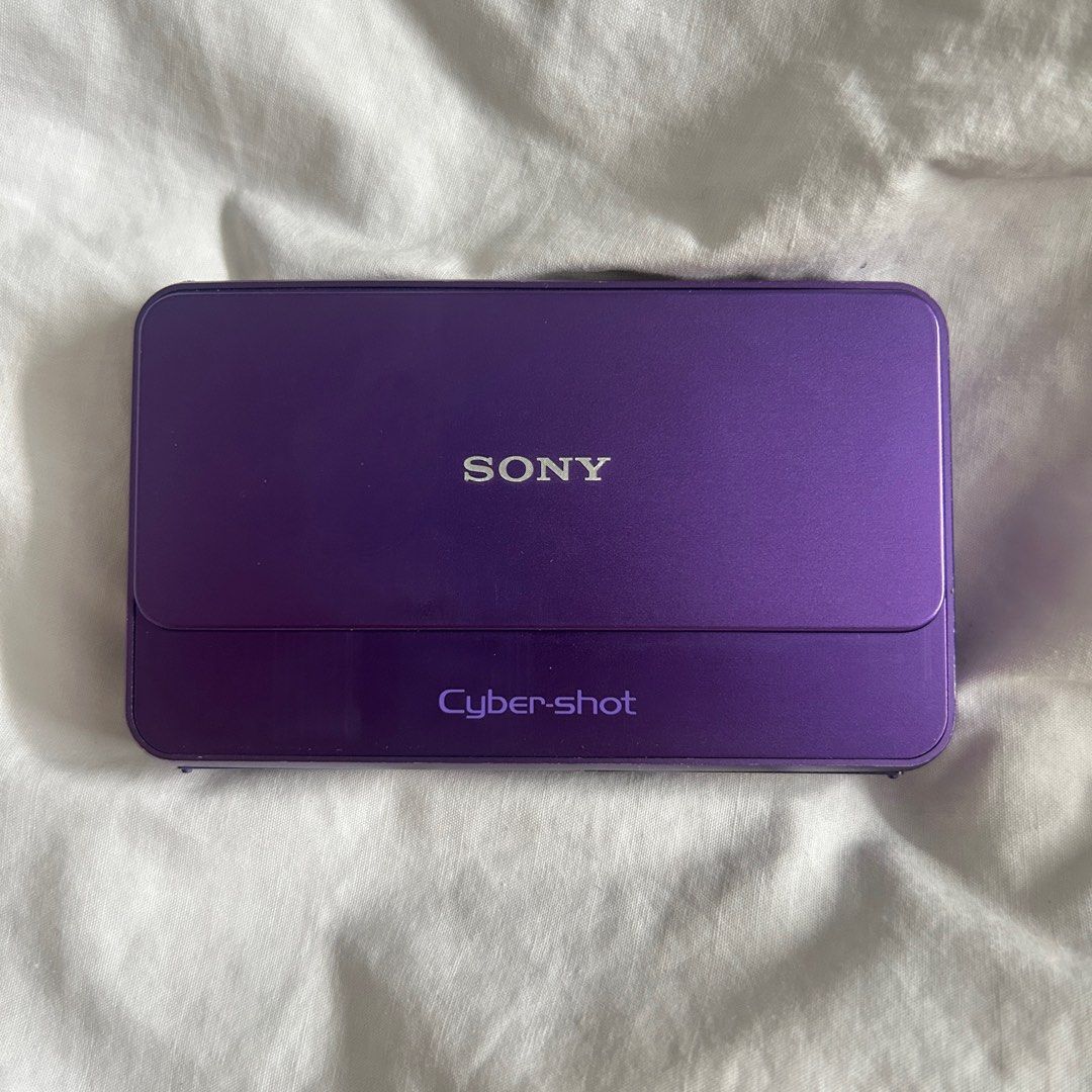 Sony Cybershot DSC-T99 (Purple) (Fully functioning digicam) (Category: Cameras) located in Pasig City. Submitted by 33melocoton (Listing ID 1400050080, Image 2). Description: - Sony Cybershot DSC-T99 (14.1 Mega Pixels) - With battery and charger, NO SD card .