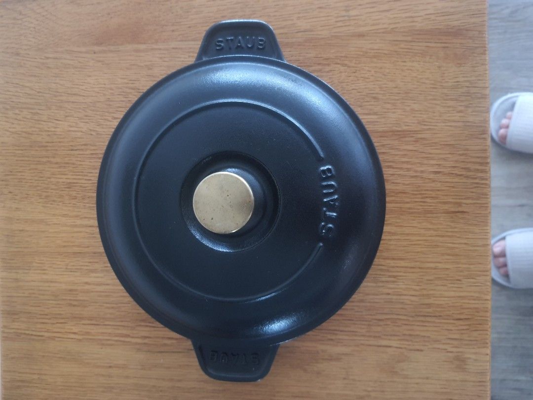 Staub 20cm Cast Iron Pan with Lid (Category: Cookware & Accessories) located in Mandaluyong City. Submitted by shark198 (Listing ID 1400130010, Image 1). Description: - Staub 20cm Cast Iron Pan with Lid - Color: Black - Lid features a brass knob - Made in France - Staub logo visible on pan and lid - Two handles for easy handling.