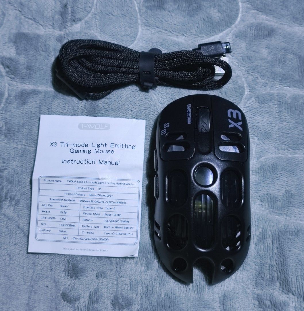 T-WOLF X3 Wireless Charging Three-Mode Gaming Mouse (Category: Mouse & Mousepads) located in Manila. Submitted by elladejesus.05 (Listing ID 1400179458, Image 3). Description: T-WOLF X3 Wireless Gaming Mouse Brand New! - Three Connection Modes: 2.4G Wireless, Type-C, and Bluetooth 5.0 - High-Performance PAW3311 Sensor - Eye-catching RGB Lighting - Wireless Charging Capability - Long-lasting 500mAh Battery - Stylish Black Design - Unique "Hole in 
