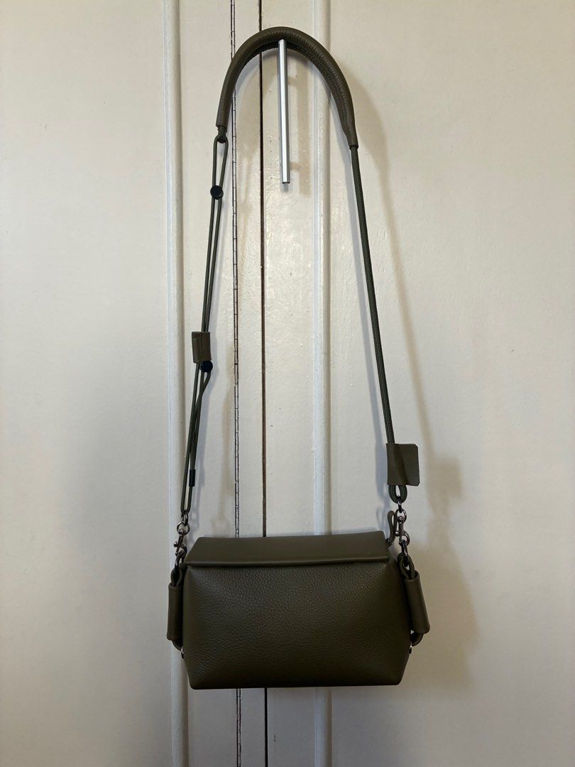 Absolute_Clay Model III Sling Bag (Category: Luxury Bags & Wallets) located in Taguig. Submitted by juju428 (Listing ID 1400205957, Image 1). Description: Absolute_Clay Sling Bag (Topologie alternative) - Bought in Chatuchak Market, Bangkok last April - olive greeb Cowhide leather with suede interior, leather and parachord adjustable strap - Used only twice - Dimensions: L - 9.5 inches H - 4.5 inches W - 3 inches .